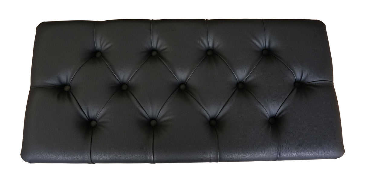 Close-up of button-tufted piano bench seat with padded vinyl top