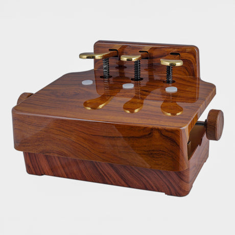 Children's piano pedal extender with 3 pedals in a brown walnut finish