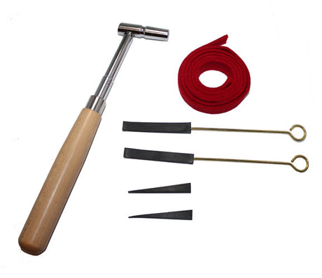 Piano tuning kit with star tip hammer, red temperament strip, and four rubber mutes