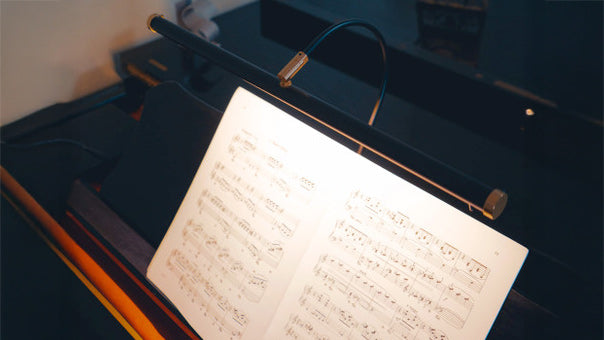 Cocoweb GPLED19 piano lamp showing even LED light across sheet musi