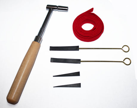 Beginner piano tuning kit including star tip tuning hammer, red wool felt strip, and rubber mutes