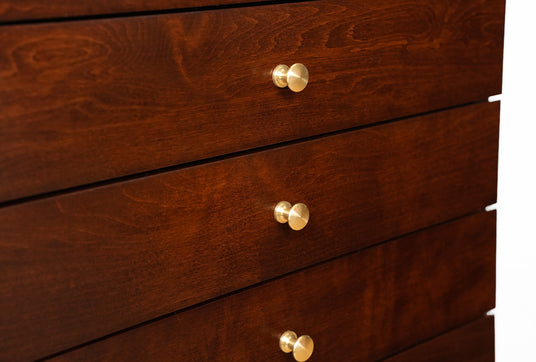 Elegant brass hardware on 9-drawer sheet music cabinet