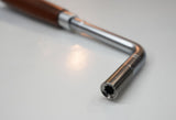 Close-up of star tuning tip on rosewood handle gooseneck piano tuning lever