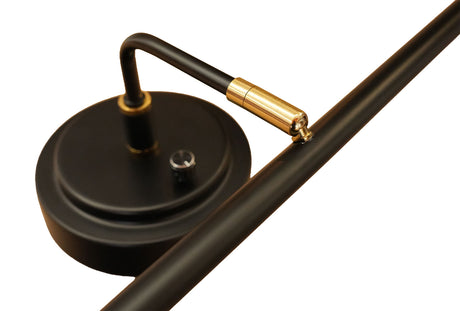 flexible arm detail of LED piano lamp showing brass joint hardware