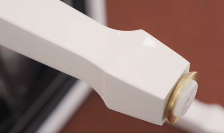 white piano bench leg